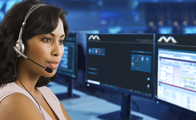 Operator in front of several computer monitors.